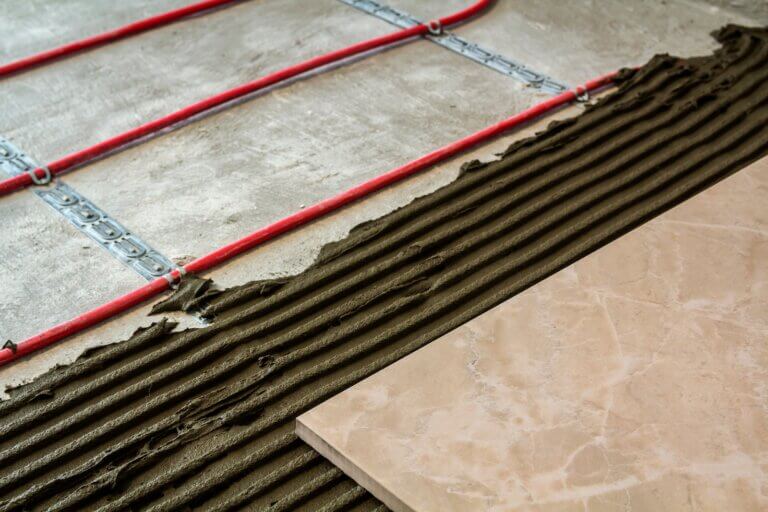 Floor tiles installation with heating elements.